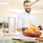cheerful-chef-holding-frying-pan-52CAKMV-scaled-1-e1607514561456.jpg