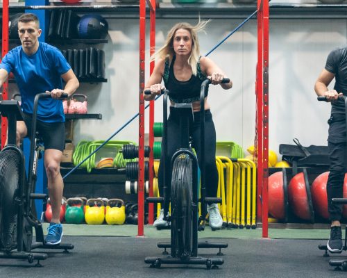 athletes-doing-air-bike-indoor-2021-08-29-19-40-47-utc-scaled.jpg