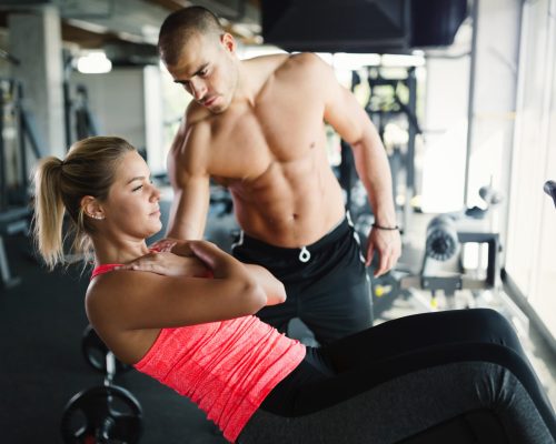 beautiful-girl-working-out-with-personal-trainer-2021-08-26-17-32-44-utc-scaled.jpg