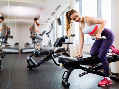 fit-woman-working-out-in-gym-2021-08-28-08-37-25-utc-scaled.jpg