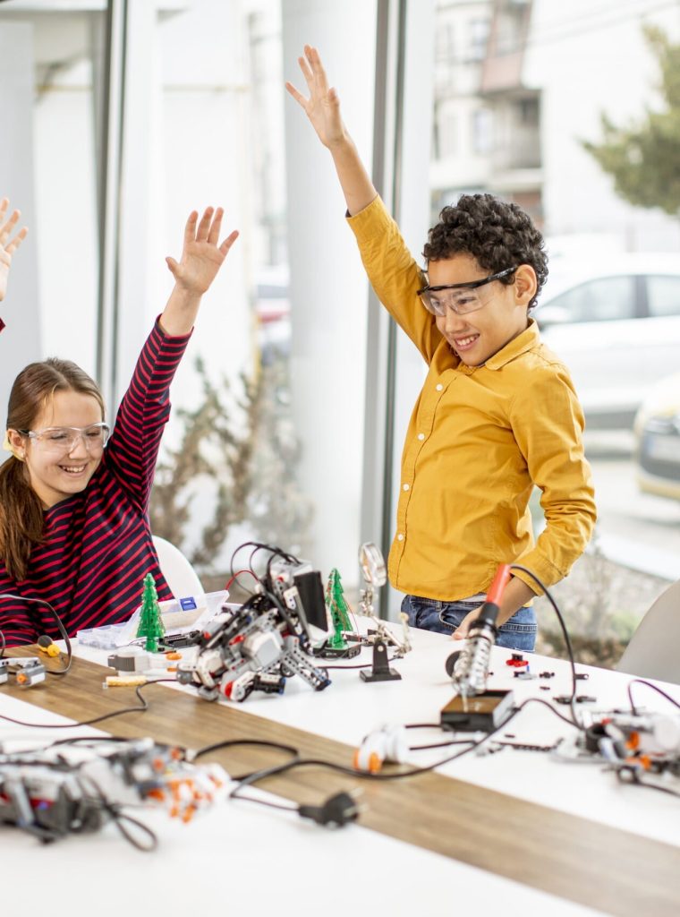 happy-kids-programming-electric-toys-and-robots-at-2022-04-16-12-27-58-utc-scaled.jpg