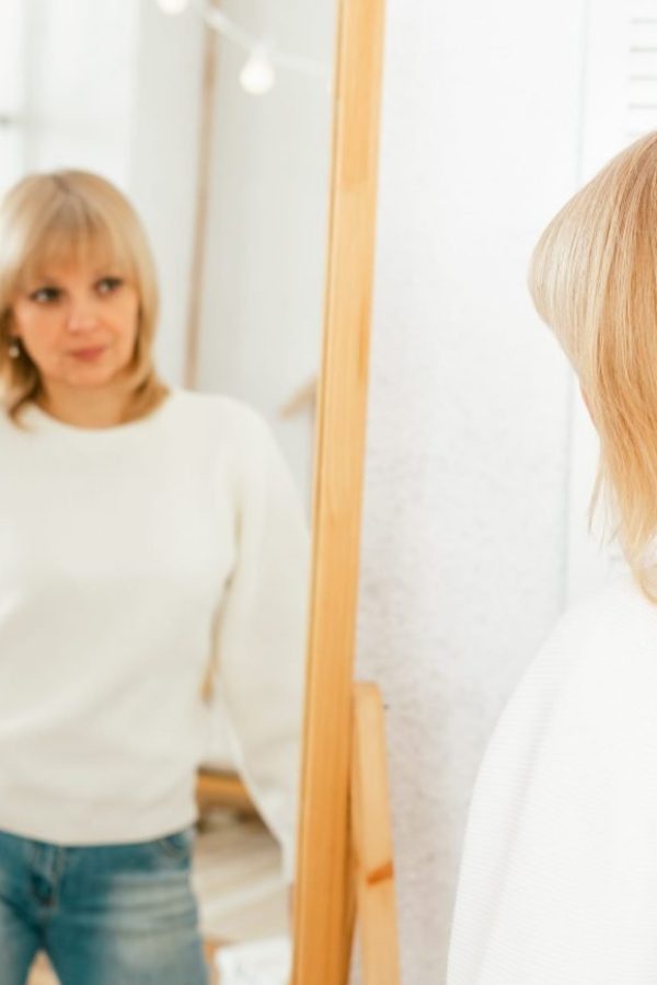 mature-adult-woman-looking-ar-mirror-2021-09-04-03-22-37-utc